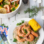 Bayou Shrimp Pasta | WorldofPastabilities.com | Zesty Cajun Bayou Shrimp Pasta is the must do beach recipe! Simple to make it delivers a ton of flavor. Get messy and have fun with the entire family!