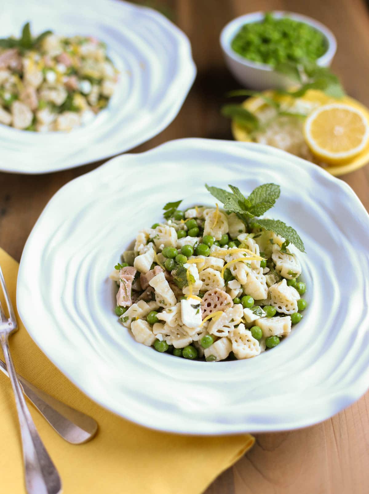 Light and Herby Mediterranean Pasta Salad | Lemon, Feta, and Fresh Chopped Herbs make this a light and delicious side dish! A tangy vinaigrette dressing ties it all together...yum! Great with any grilled meats or seafood! | WorldofPastabilities.com