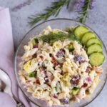 Tzatziki Pasta Salad | Cool and tangy Tzatziki Pasta Salad is the perfect side for a hot summer night! Artichokes, sun dried tomatoes, Kalamata olives, and crunchy cucumbers add just the right Greek flavors. Yum! Serve with grilled meats or chicken! Enjoy! | WorldofPastabilities.com