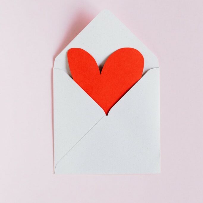 heart coming out of an envelope