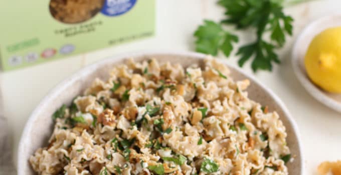 Toasted Nut and Feta Pasta in Bowl next to Good Day Pasta Box