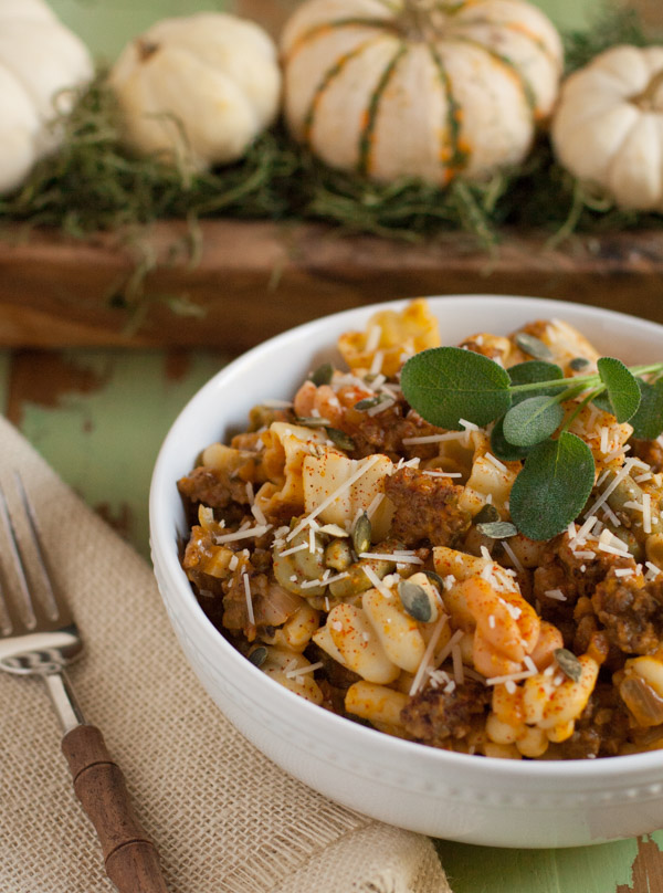 Italian Sausage and Pumpkin Pasta combines delicious fall flavors and textures. Pumpkin, Italian sausage, coconut milk, and spices create a hearty yet light pasta! Your tastebuds will love it! | WorldofPastabilities.com