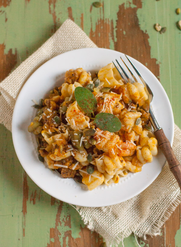 Italian Sausage and Pumpkin Pasta combines delicious fall flavors and textures. Pumpkin, Italian sausage, coconut milk, and spices create a hearty yet light pasta! Your tastebuds will love it! | WorldofPastabilities.com