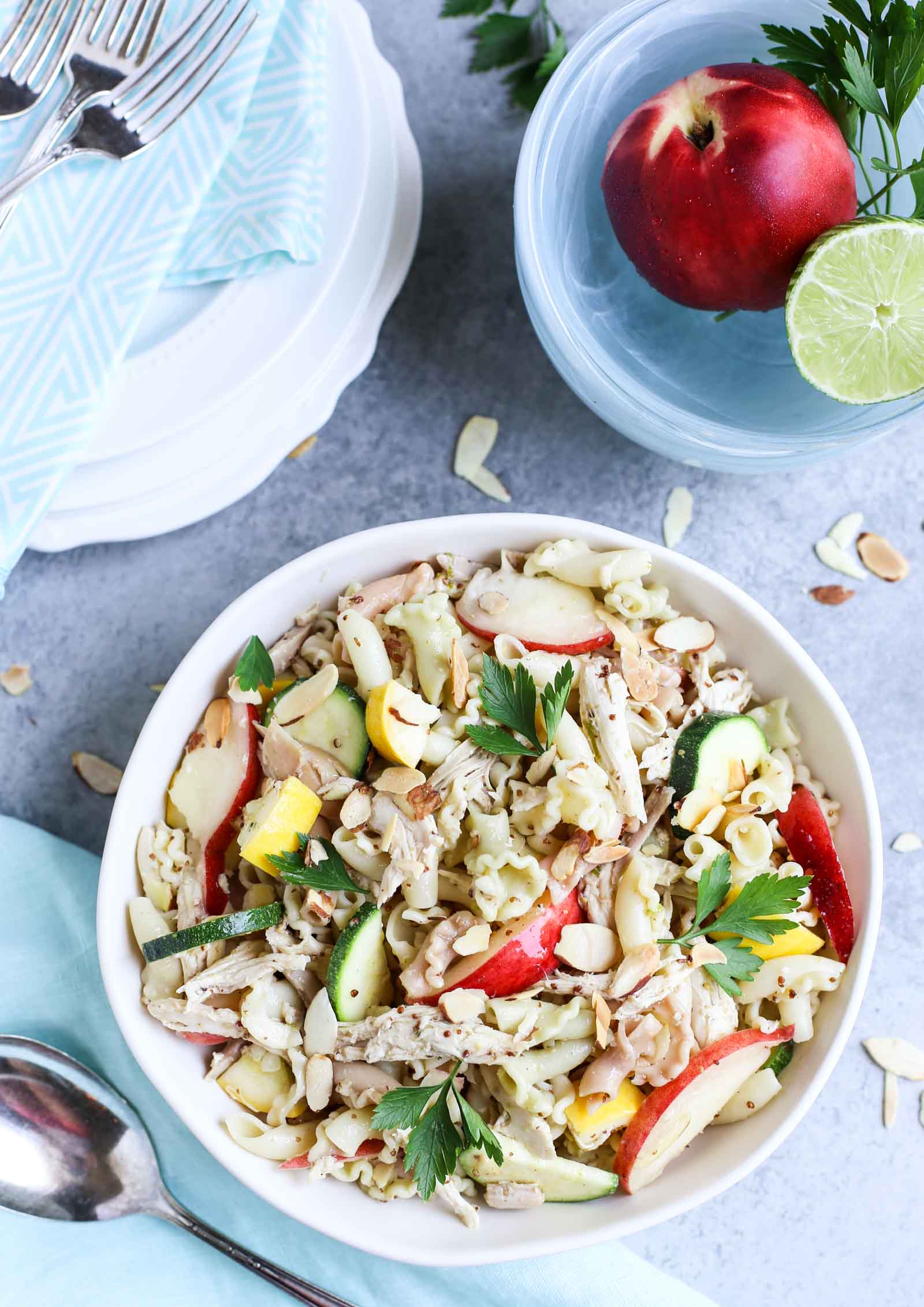 Summertime Chicken Pasta Salad with Nectarines & Squash | Tangy Lime Vinaigrette ties together a delicious unexpected surprise! Perfect as a main course and perfect for summer! Simple and delish! | WorldofPastabilities.com